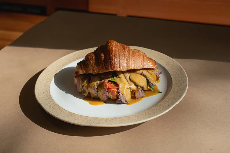 Roast beef croissant on a plate