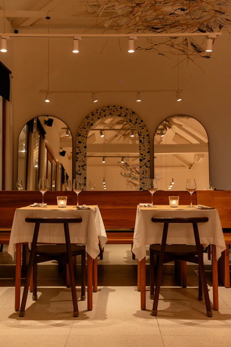 Dining room with arched windows and set tables