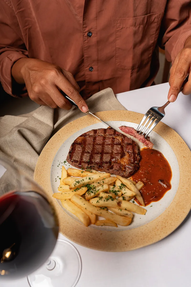 Steak frites with a glass of red wine