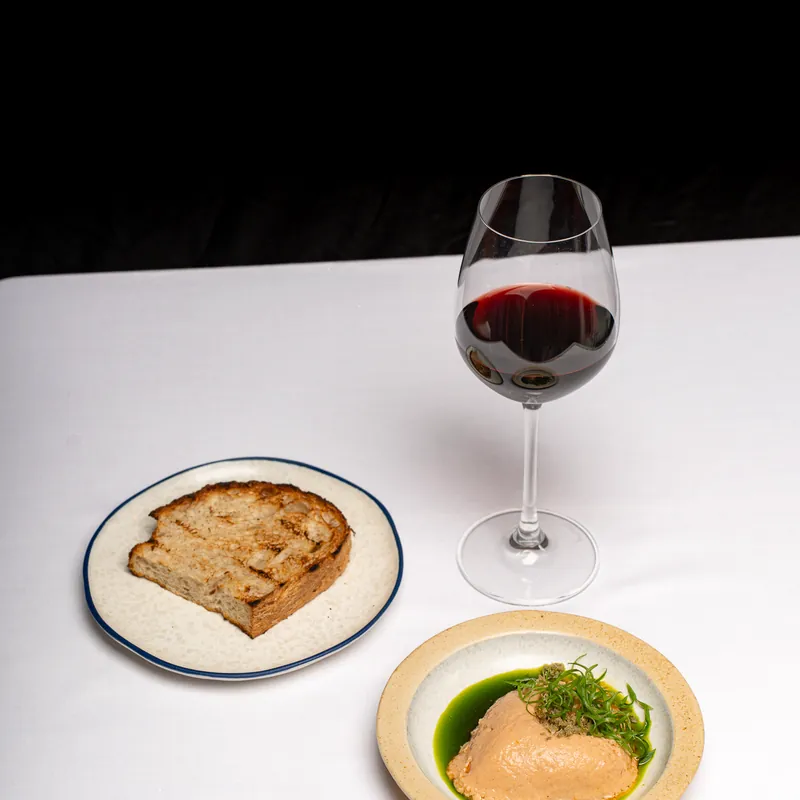 Toast beside a glass of red wine