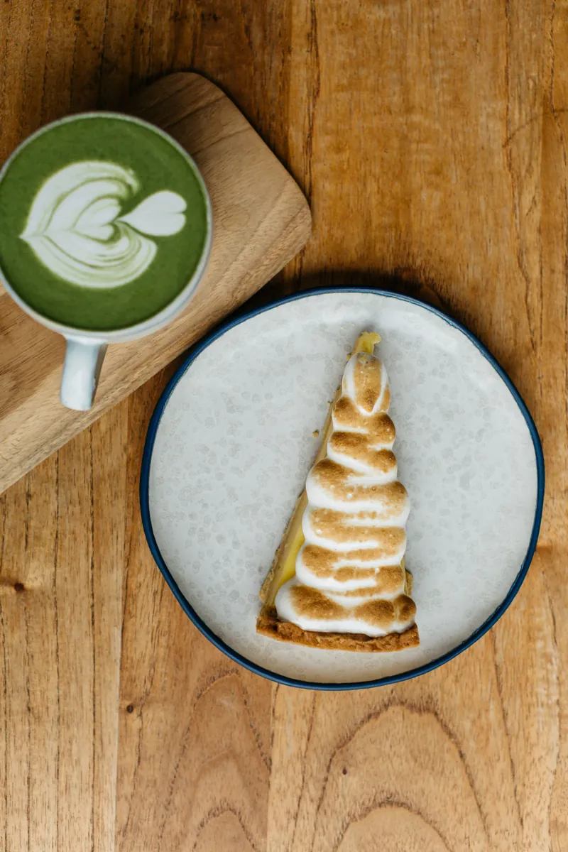 Matcha latte and a lemon meringue tart