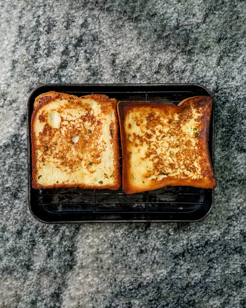 Two slices of French toast on a tray
